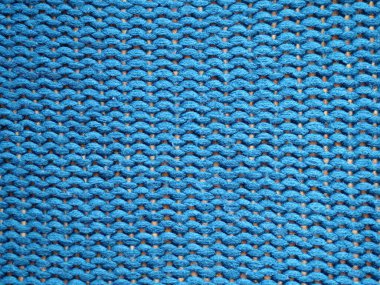 Mavi örülmüş arka plan, Purl döngüleriyle örülmüş..