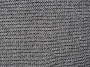 Gri örülmüş arka plan, yüz döngüleriyle örülmüş. El örgüsü..