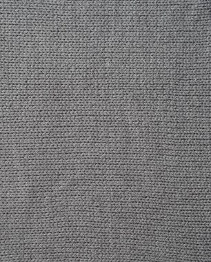 Gri örülmüş arka plan, yüz döngüleriyle örülmüş. El örgüsü..