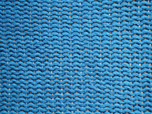 Fundo texturizado de malha azul, tricotar com laços purl . — Fotografia de Stock