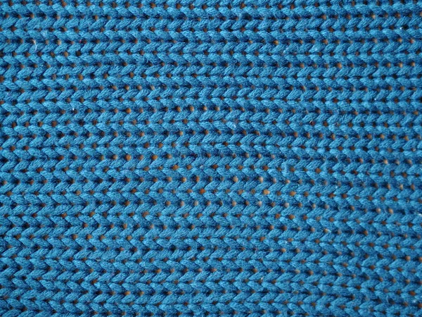 Blue knitted textured background, knit with facial loops. — Stock Photo, Image