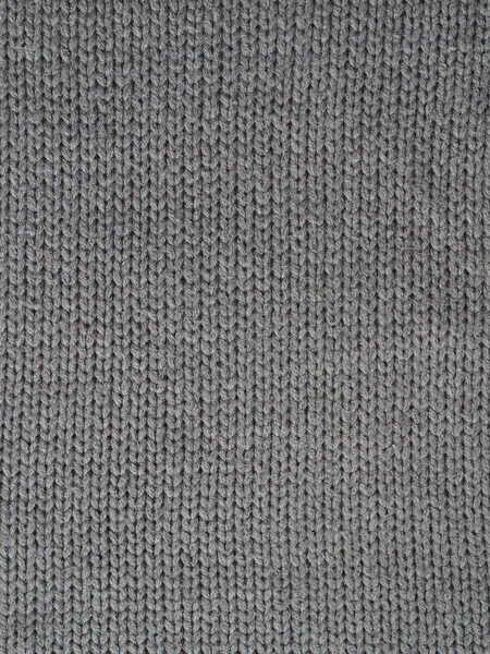 Серый трикотажный текстурированный фон, вязаный с петлями на лице. Ручное вязание . — стоковое фото