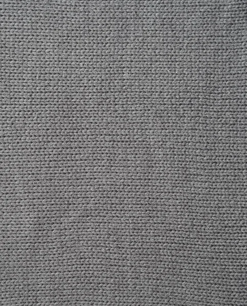 Fondo grigio lavorato a maglia, lavorato a maglia con passanti per il viso. Maglia a mano . — Foto Stock