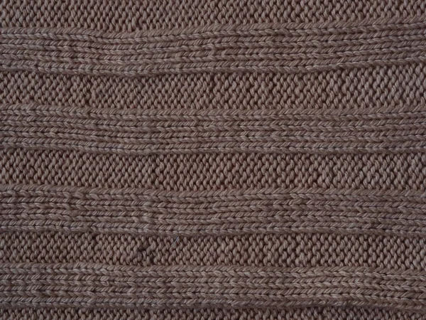 Brown knitted textured background, knit with the front and back loops. Hand knitting. — Stock Photo, Image