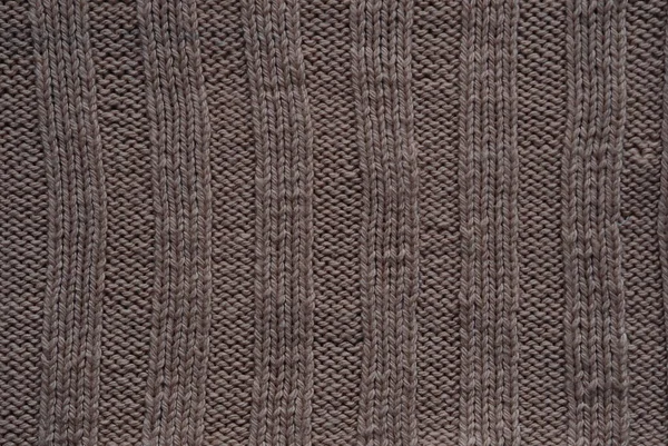 Fond texturé en maille marron, tricoter avec les boucles avant et arrière. Tricot à main . — Photo