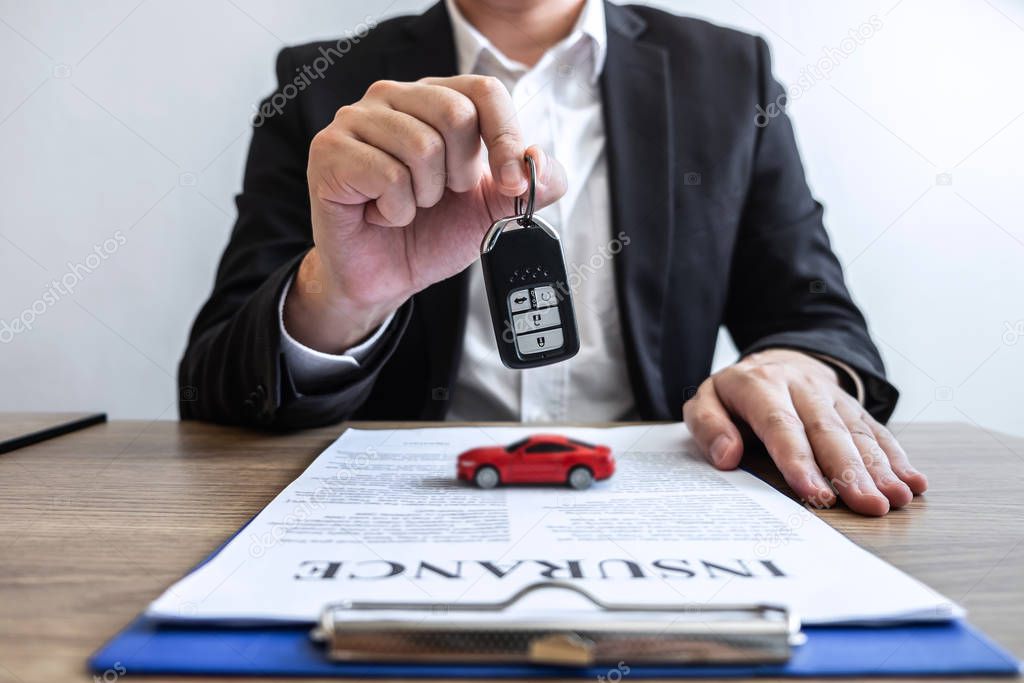 Car rental and Insurance concept, Young salesman receiving money