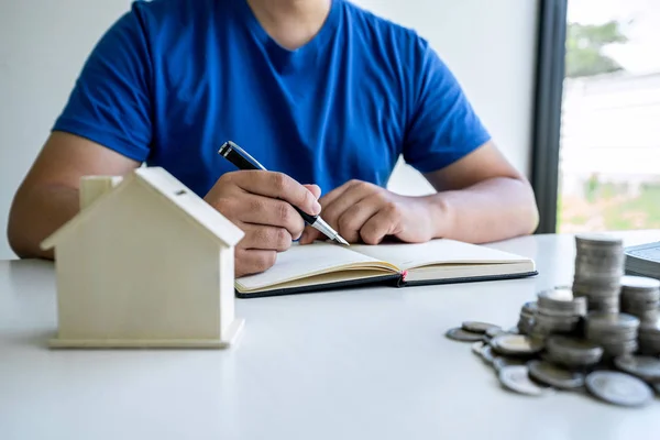 Man writing report to planning growing saving to strategy with m