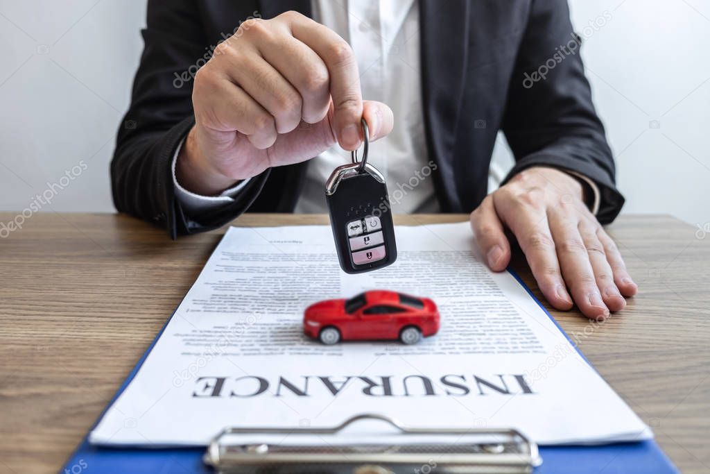 Car rental and Insurance concept, Young salesman receiving money