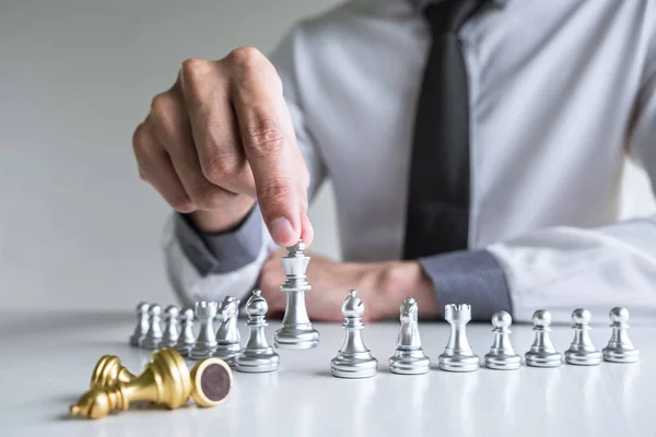 Gold and silver chess with player, Hands of businessman moving c — Stock Photo, Image