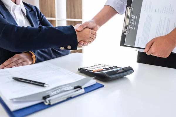 Good deal of interview, Business committee and recruiter shaking hands greeting or get acquainted of conducting a job interview while sitting at the working meeting in office.