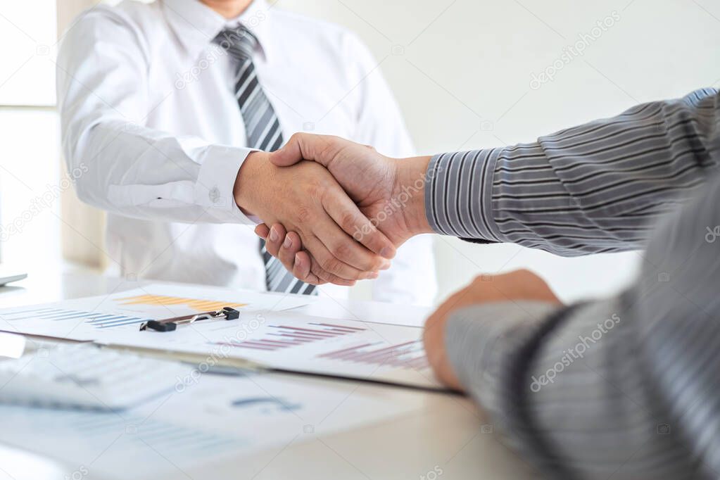 Finishing up a meeting collaboration, handshake of two business people after contract agreement to become a partner, collaborative teamwork.