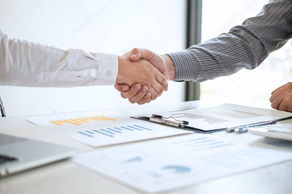 Finishing up a meeting collaboration, handshake of two business people after contract agreement to become a partner, collaborative teamwork.