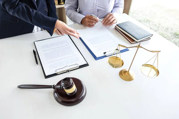 Professional female lawyer or counselor discussing negotiation legal case with client meeting with document contract in office, law and justice, attorney, lawsuit concept.