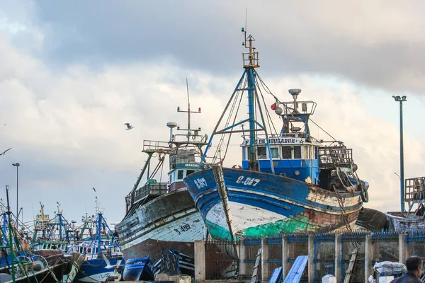 Fishing boats heel for repairs in the old port of Essaouira