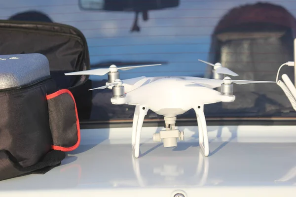 Drone lies on the trunk of the car — 스톡 사진