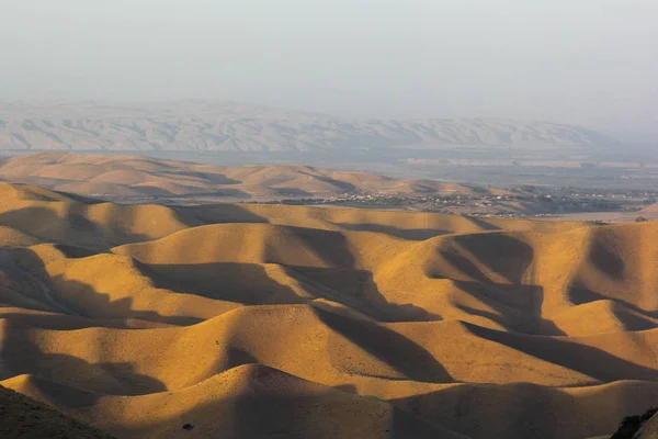 Sunset over golden hills in Dushanbe, Tajikistan