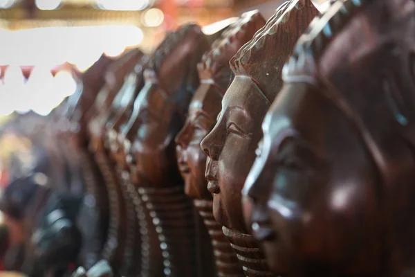 Wooden figurines souvenirs in the market of Myanmar