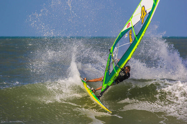Windsurfing wave riding and jumpings on the perfect waves