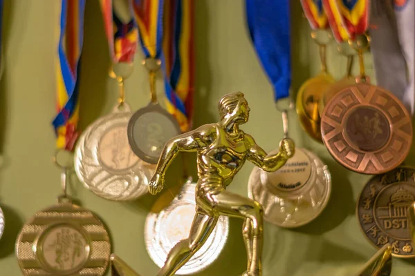 Gold Trophy Symbolizing Athlete Running Many Medals Background Bucharest Romania — Stock Photo, Image