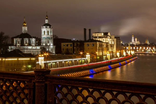 The long-exposure photo was taken from Bolshoy Ustyinskiy Bridge. It shows the Church of St. Nicholas in Zayaitsky, which is located on the Moscow River embankment in the historical center of Moscow. 