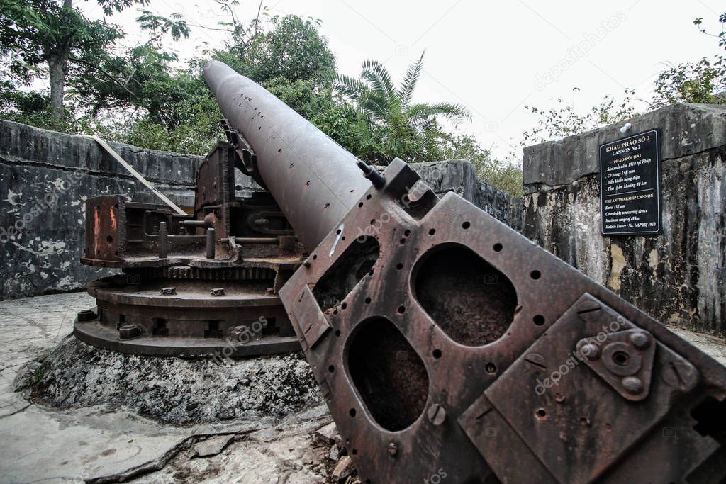 Wide-angle shot of the cannon located in the Fort at the highest point of the island of Cat BA. This weapon was used during the Vietnam war in the Northern Vietnam.