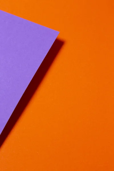 Paper color for background. Abstract pastel colored paper texture minimalism background in orange and purple.