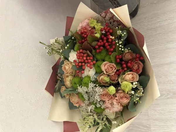 A bouquet of flowers from loved ones and a loved one, joy and happiness in the eyes, being loved to feel love, joy and happiness, rest from worries, a beautiful wrapper and. A homemade bouquet of flowers on a typical weekday is a simple joy of dreams