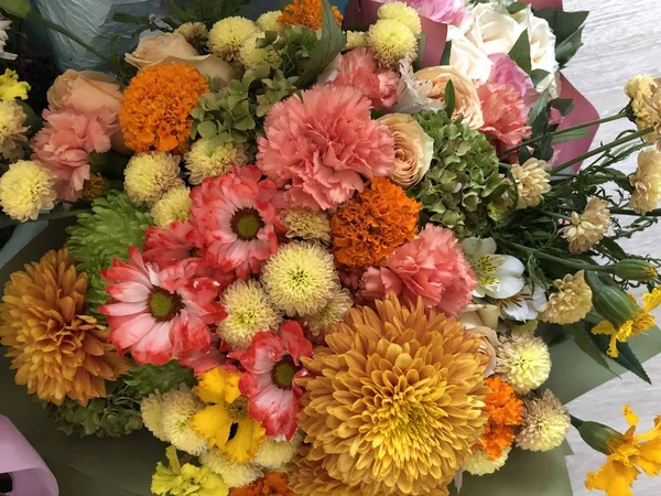 A bouquet of flowers from loved ones and a loved one, joy and happiness in the eyes, being loved to feel love, joy and happiness, rest from worries, a beautiful wrapper and. A homemade bouquet of flowers on a typical weekday is a simple joy of dreams