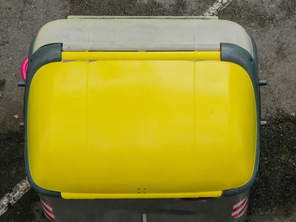 Yellow garbage container for plastic recycling