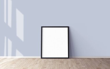 Yerde beyaz bir poster ve boş çerçeve modeli var. Modelleme.