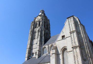 The exterior of Sint Walburgakerk (Saint Walbergs church) Oudenaarde, in East Flanders, Belgium. Against a blue sky with copy space.