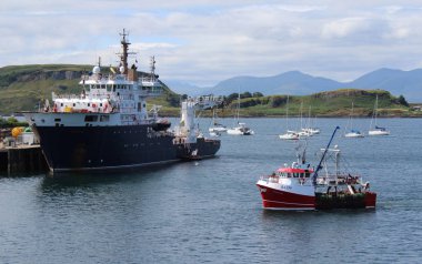 OBAN, SCOTLAND, 25 JULY 2018: View accross Oban Harbour towards the Isle of Mull. Oban is a town in the Western Highlands and the 'Gateway to the Isles'.