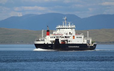 MULL, SCOTLAND, 25 JULY 2018: MV Coruisk sailing in the sound of Mull. It is a Caledonian Maritime Assets Ltd ferry built in 2003, operated by Caledonian MacBrayne, serving the west coast of Scotland. clipart