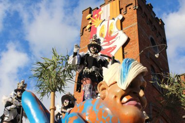 AALST, BELGIUM, 12 FEBRUARY 2018: Unknown Aalst carnival participants celebrate during the annual street parade. Aalst Carnival is recognized by UNESCO as an event of Intangible Cultural Heritage.  clipart