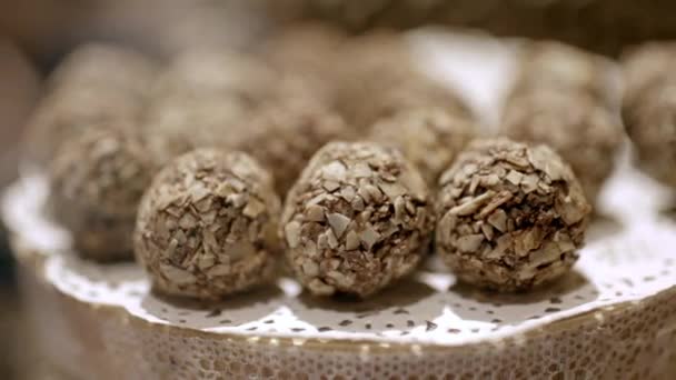 Chocolate balls sprinkled with coconut — 비디오