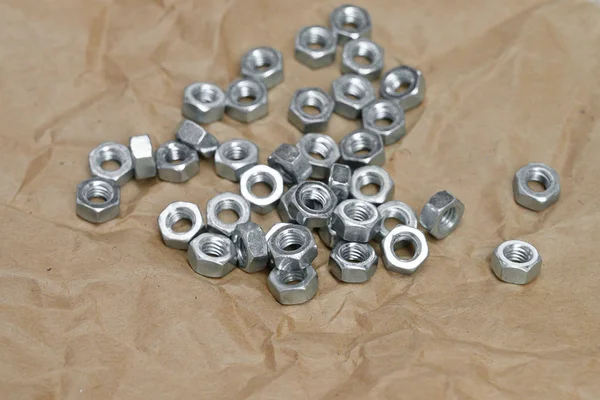 Set Metal Nut Kraft Paper Close — Stock Photo, Image