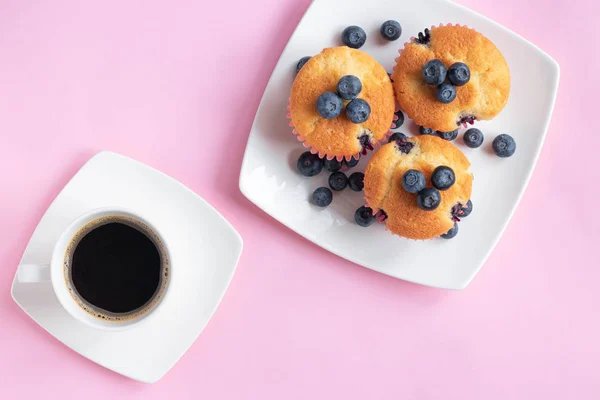 Blueberry cupcakes and cup of coffee. Perfect breakfast and start of the day. Top view