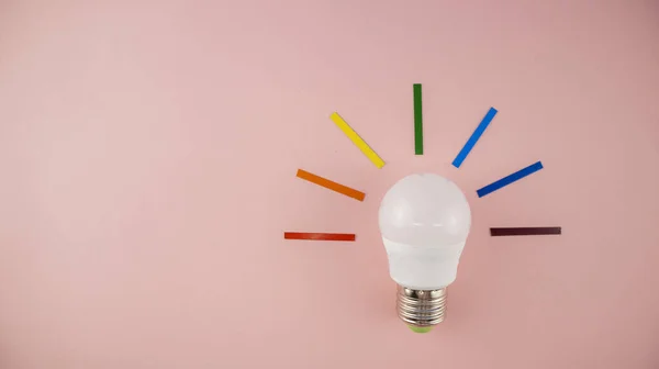 light bulb with multicolored rays in the form of light