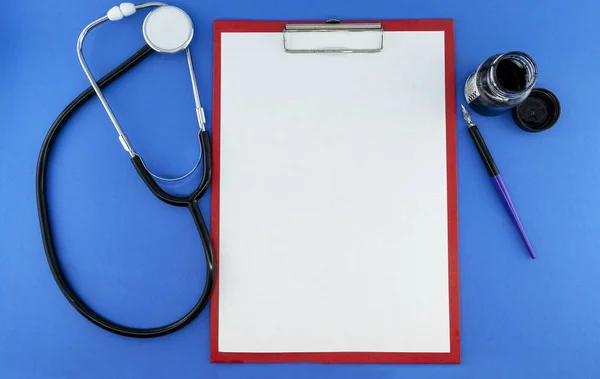 Medical Instruments Paper Folder Pen Mock Isolates Blue Background — Stock Photo, Image