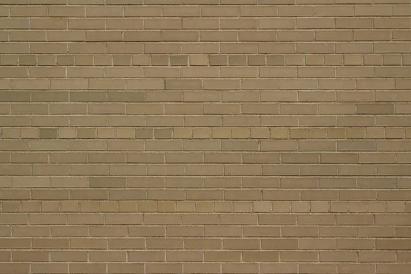 Vintage beige gray brick wall texture background with an American common bond brickwork pattern