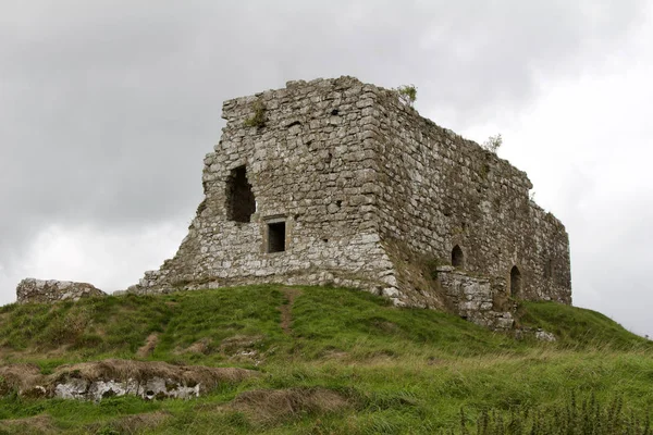 Ancient castle ruins on a hilltop in Ireland