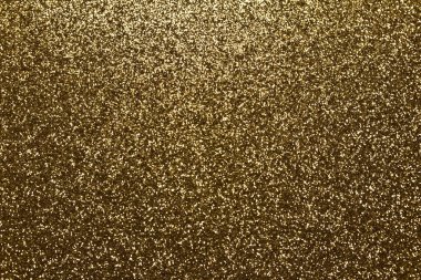 Işıltılı altın parıltısının makro soyut dokusu