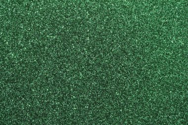 Işıl ışıl yeşil parıltıların makro desen arka planı