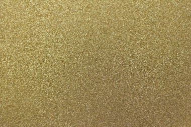 Işıldayan altın parıltısının makro soyut dokusu arka planı