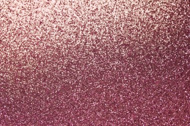 Bokeh ile odaklanmış pembe parıltı dokusunun makro soyut arkaplanı