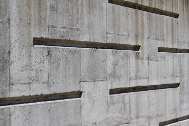 Modern çizgi tasarımı ile beyaz beton duvar dokusu arkaplanının görüntüsünü kapat (açı görünümü)