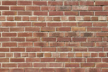 Paslı, paslı, kırmızı tuğla duvar dokusu arkaplanı ve paslı havan topu.