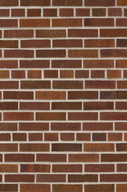 Modern, kahverengi desenli tuğla duvar arkaplanının beyaz harç ile genel bir tahvil kalıbında yakın görünümü