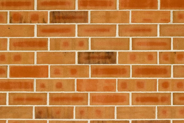 現代的なオレンジレンガの壁のテクスチャの背景と1 3オフセットステージレンガ造りのパターン — ストック写真