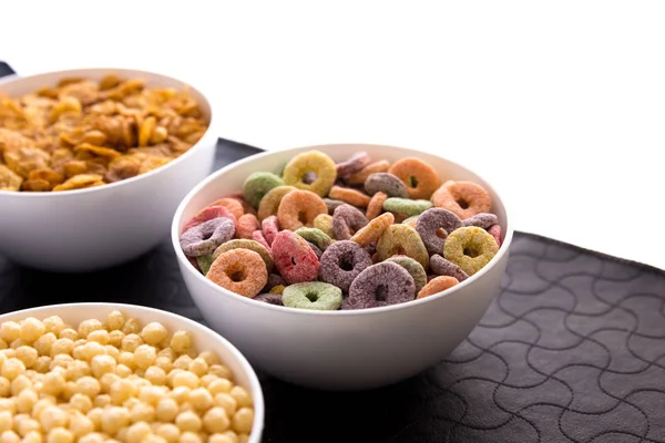 Detail of cereals in bowls on black background — Stock Photo, Image